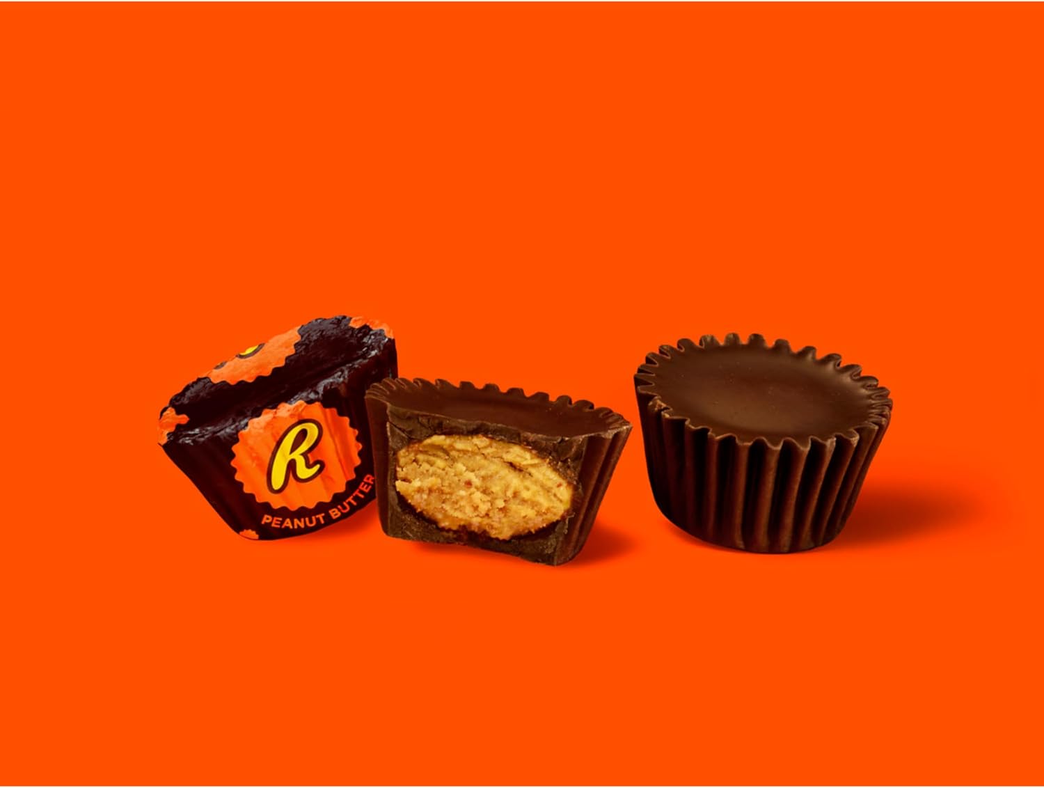 Unwrapped Reese’s Miniatures Dark showing creamy peanut butter center