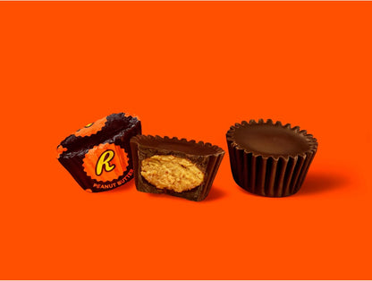 Unwrapped Reese’s Miniatures Dark showing creamy peanut butter center