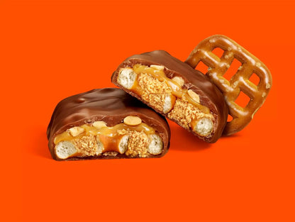 Unwrapped Reese’s Overload bar showing peanut butter layers