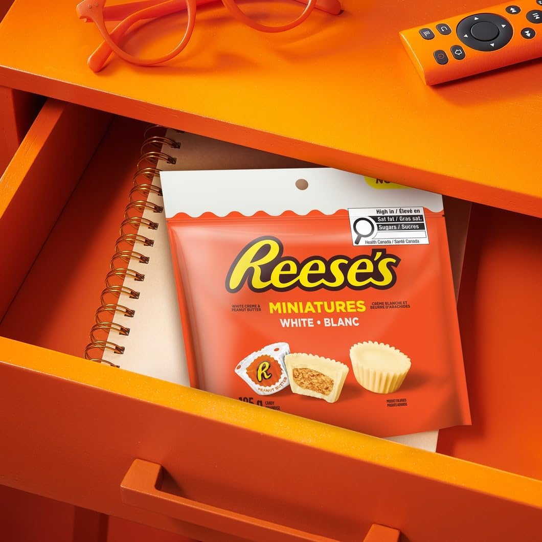 Unwrapped Reese’s Miniatures White showing creamy peanut butter center