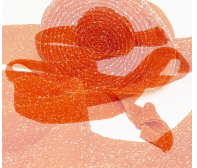 A 40g Rip Rolls Mango Chilli candy roll featuring bold packaging showing ripe mango and chili peppers.