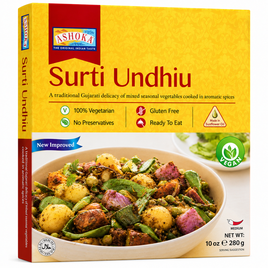 A box of Ashoka Surti Undhiu, a traditional Indian mixed vegetable curry, shown on a clean white background. The packaging is primarily yellow with red accents, featuring a photo of the prepared dish in a bowl on the front.