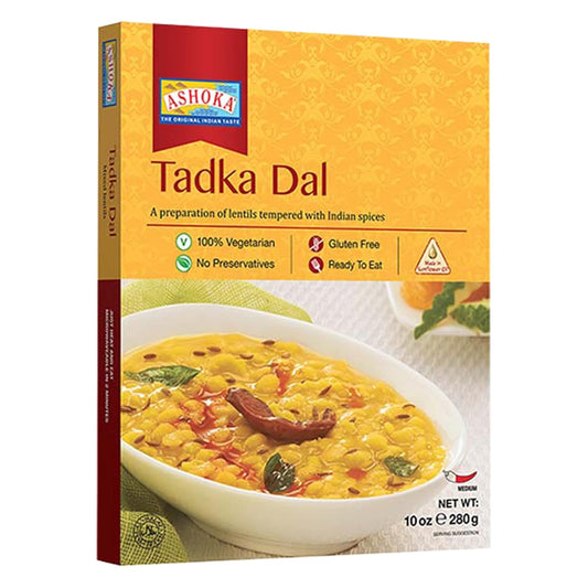 Box of Ashoka Tadka Dal with a bowl of dal on a white background