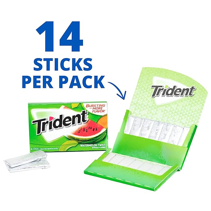 Hand holding a piece of Trident Watermelon Twist sugar-free gum