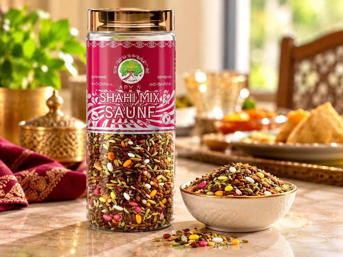 Aryan Shahi Mix Saunf 160g jar displayed beside a bowl of colourful fennel seed mouth freshener on a tabletop with decorative Indian tableware and warm ambient lighting.