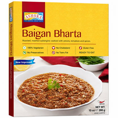 A box of Ashoka Baigan Bharta, a roasted mashed submerge dish. The packaging features a bright yellow top half with red and blue branding, and a lower half showing a bowl of the brownish-red food with green garnish.