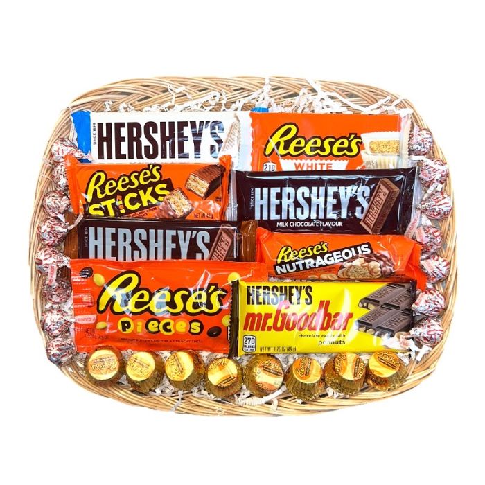 Basket filled with Hershey’s and Reese’s chocolates, including bars and wrapped treats.
