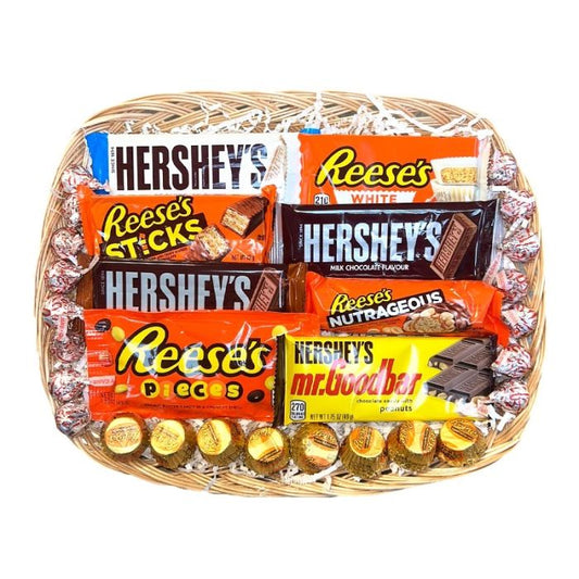 Basket filled with Hershey’s and Reese’s chocolates, including bars and wrapped treats.