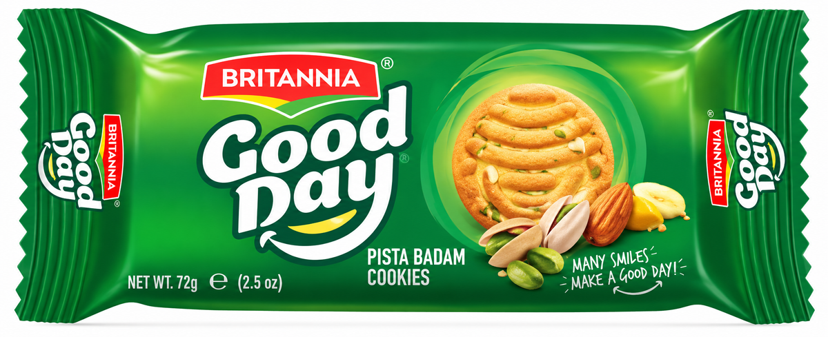 Golden Britannia Good Day-style pista badam cookies with pistachio and almond pieces arranged on a plate beside a cup of tea on a wooden board.