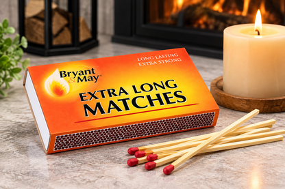 Bryant & May Extra Long Matches box with long wooden matches beside a candle in a warm home setting