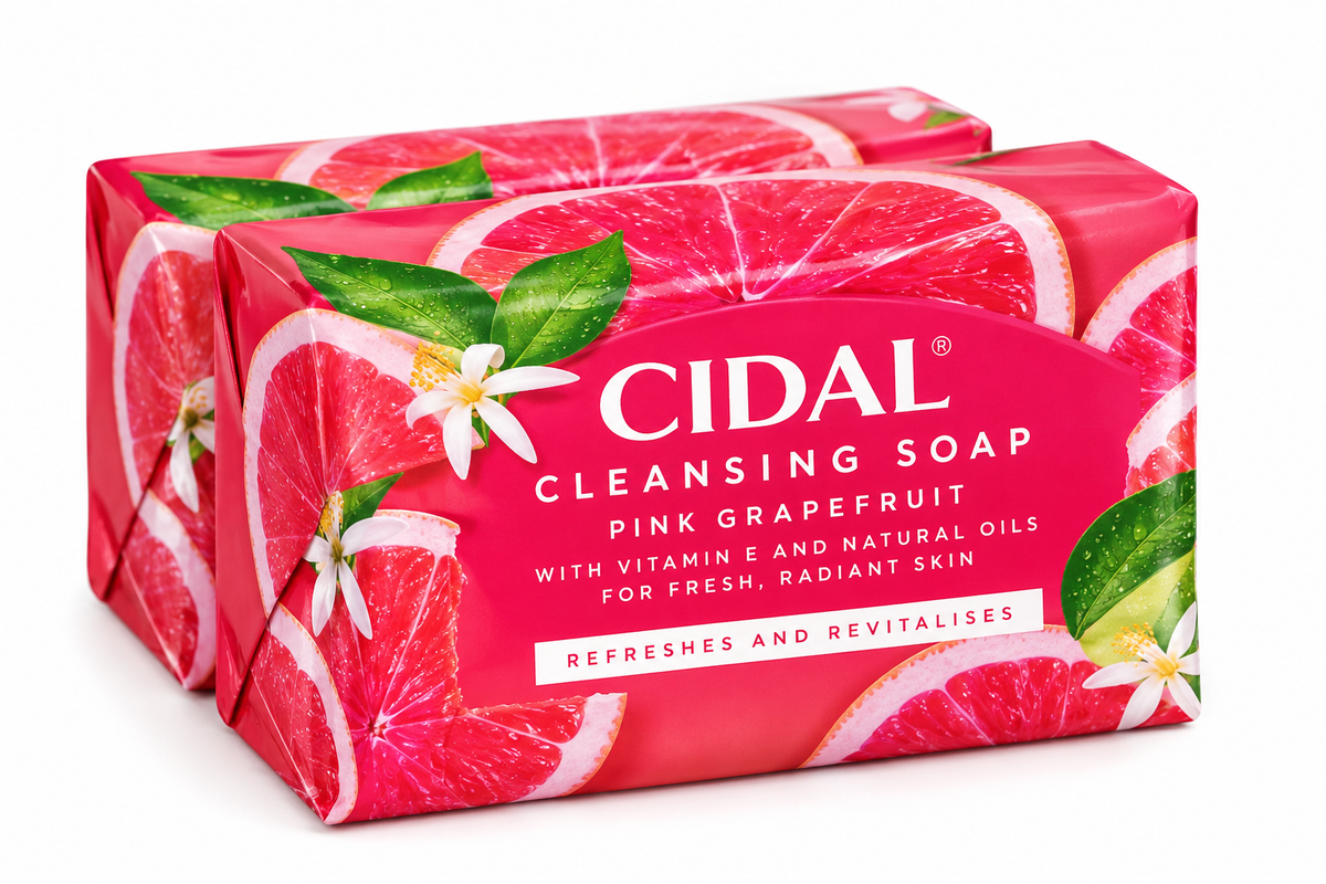 Cidal Pink Grapefruit Cleansing Soap 2 Pack x 100g featuring two rectangular soap bars wrapped in vibrant pink and red packaging, decorated with juicy pink grapefruit slices, fresh green leaves, and delicate white citrus blossoms. The packaging displays the Cidal branding, Pink Grapefruit Cleansing Soap name, and text highlighting vitamin E, natural oils, and a refreshing cleansing experience. Arranged against a clean white background, showcasing the grapefruit-scented soap multipack for everyday bathing.