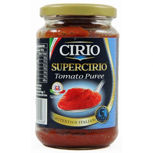 Glass jar of Cirio Supercirio Tomato Purée with gold lid, featuring a blue label and image of rich red tomato purée on a spoon, labeled “Authentico Italiano.”