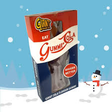 Oversized cola bottle gummy candy on a table ready to serve or share