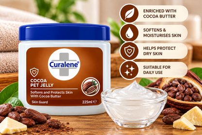 Curalene Cocoa Pet Jelly 225ml jar displayed beside a glass bowl of petroleum jelly, cocoa beans, cocoa butter pieces and green leaves, highlighting moisturising and skin-protecting care with cocoa butter.