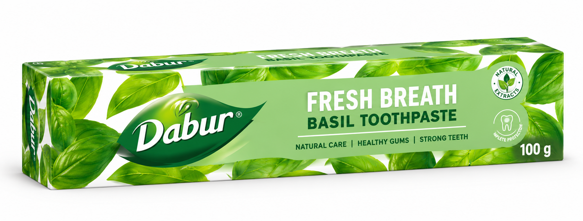 Dabur Fresh Breath Basil Toothpaste 100g carton featuring bright green leaf-patterned packaging, the green Dabur logo, prominent “Fresh Breath” and “Basil Toothpaste” lettering, and natural-care branding. The toothpaste box is displayed at an angle against a clean white background.