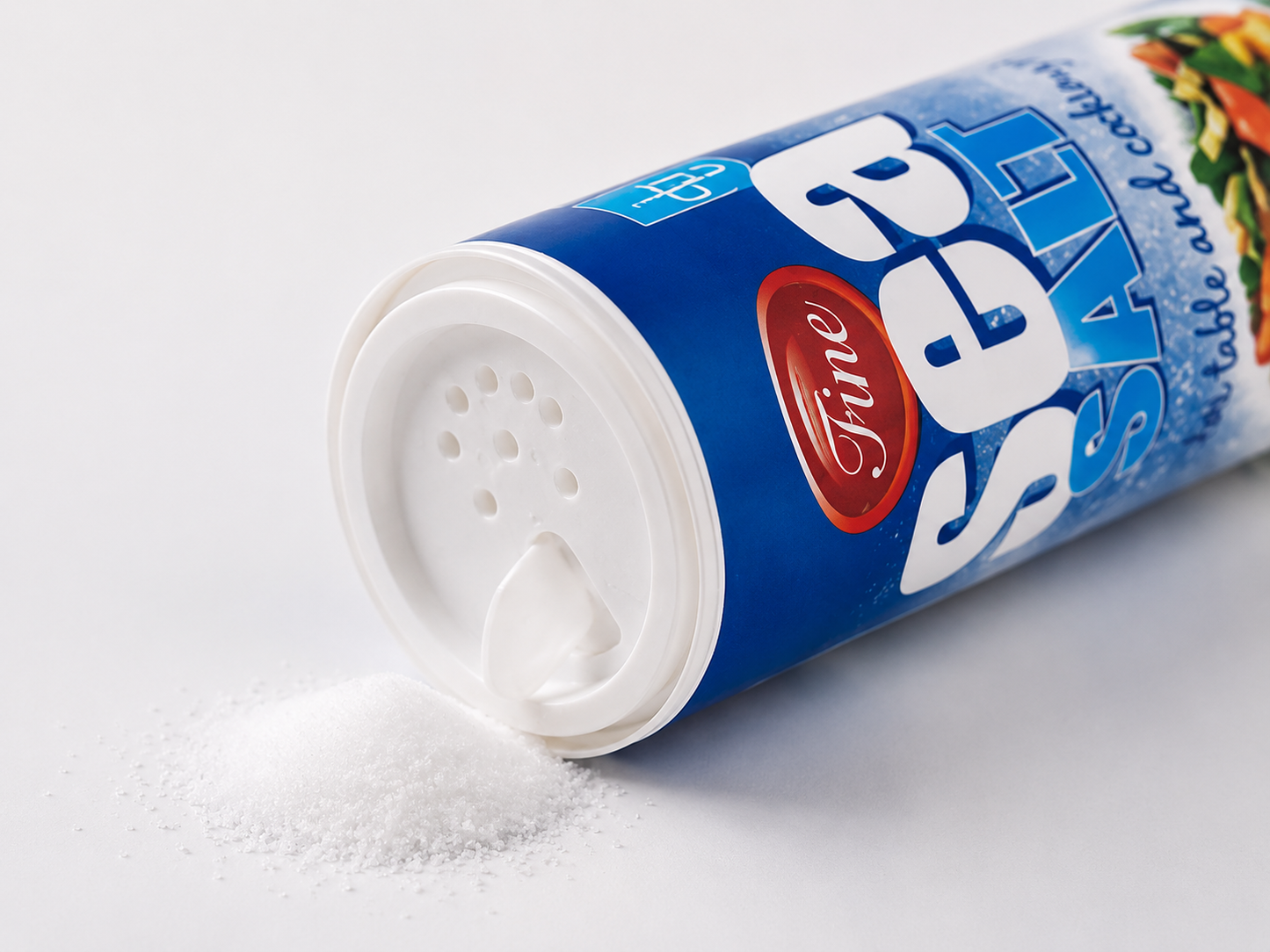 Close-up image of Fine Sea Salt 500g dispenser gently pouring fine sea salt crystals, showcasing its easy-to-use shaker lid and premium quality for everyday cooking and table seasoning.