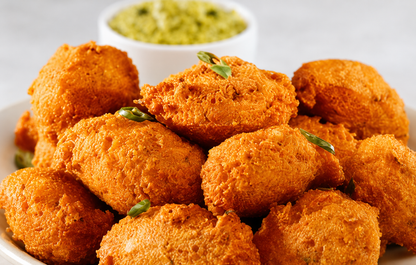 Gits Moong Dal Vada Mix prepared crispy Indian lentil fritters served on a white plate, golden and crunchy snack made from green gram lentils.