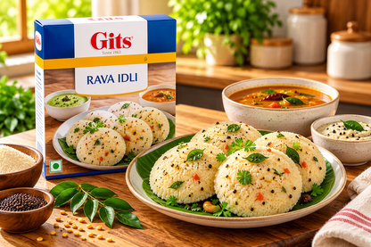 Gits Rava Idli 200g single pack served with soft semolina idlis garnished with curry leaves and mustard seeds, accompanied by sambar and coconut chutney.