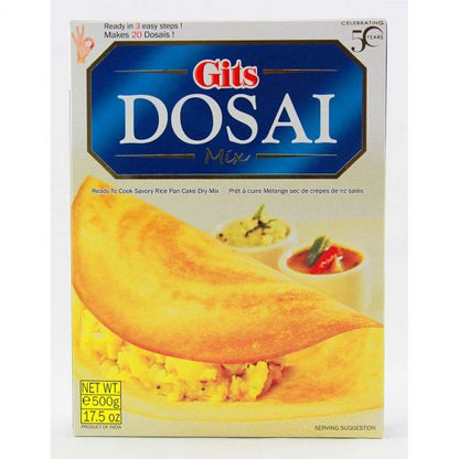 Front view of Gits Dosai Mix 500g box packaging, featuring a large golden crispy dosa folded on a plate with potato filling, served alongside small bowls of chutney and sambar, with blue and white branding on the top.