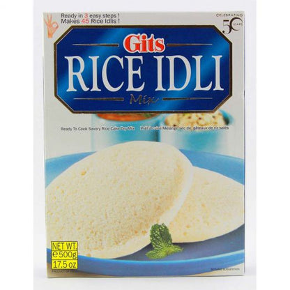 Front view of Gits Rice Idli Mix 500g box packaging, featuring two soft white idlis on a blue plate with a mint garnish, blue and white branding at the top, and “Ready in 3 easy steps” text on the package.