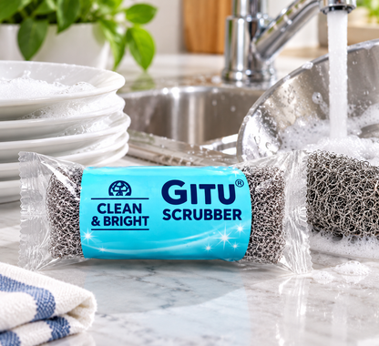GITU Clean & Bright stainless steel scrubber for cleaning dishes and utensils in a kitchen sink.