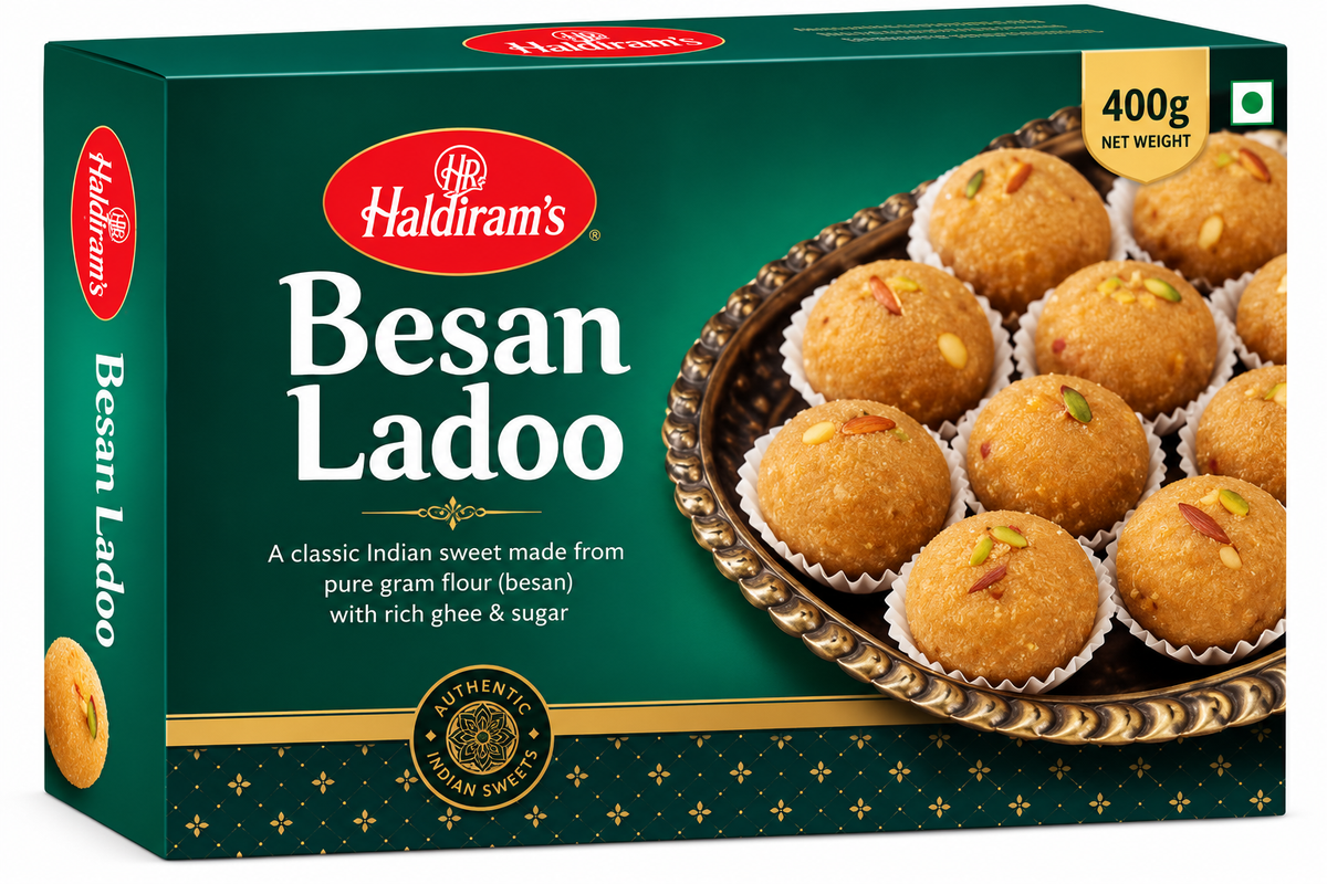 Haldiram’s Besan Ladoo 400g traditional Indian gram flour sweets topped with nuts in green and gold packaging.