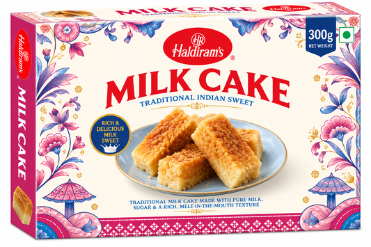 Haldiram’s Milk Cake 300g traditional Indian milk sweet with a rich, soft texture in decorative cream, pink and blue packaging.
