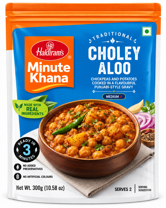 Haldiram’s Minute Khana Choley Aloo 300g ready-to-eat Punjabi curry with chickpeas and potatoes in a blue and orange pouch.
