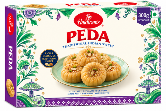 Haldiram’s Peda 300g traditional Indian milk sweets garnished with nuts in decorative cream, green and purple packaging.