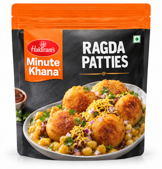 Haldiram’s Minute Khana Ragda Patties 360g pouch featuring orange and black packaging, golden potato patties served with chickpea curry, fresh coriander, chopped onions, sev, and chutney.
