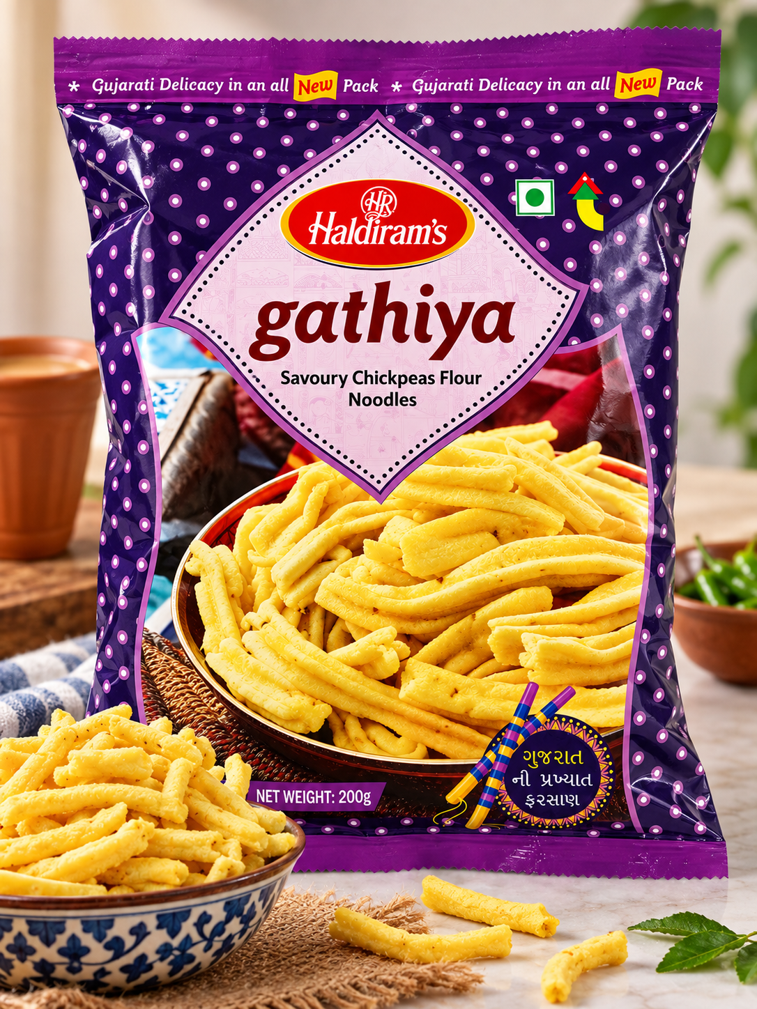 Haldiram’s Gathiya 200g Indian savoury snack packet with a bowl of crispy golden gathiya, styled for Gujarati tea-time snacking.