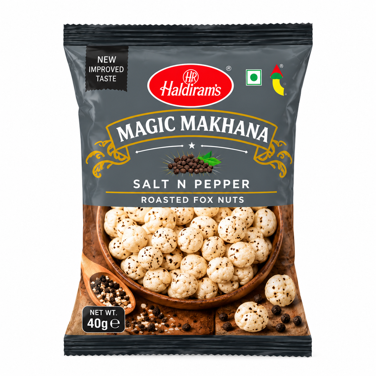 Haldiram’s Magic Makhana Salt N Pepper Roasted Fox Nuts 40g packet featuring charcoal-grey packaging, gold accents and pepper-seasoned roasted makhana on a plain white background.