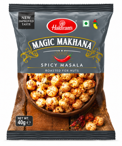 Haldiram’s Magic Makhana Spicy Masala Roasted Fox Nuts 40g packet featuring dark grey packaging with gold accents, seasoned roasted fox nuts and red chilli illustration on a clean white background.