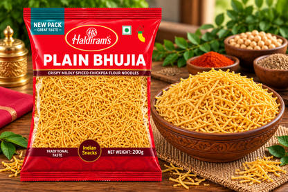Haldiram’s Plain Bhujia packet displayed beside a wooden bowl filled with golden crispy bhujia on a rustic wooden table with spices and green leaves.