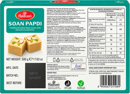 Haldiram’s Soan Papdi 500g back packaging showing ingredients, allergen information, nutrition facts, storage instructions, manufacturer details, vegetarian symbol, recycling information, product weight and barcode
