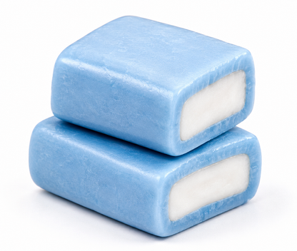 Close-up of Hi-Chew Blue Raspberry chewy candy pieces with a soft blue outer layer and creamy white centre.