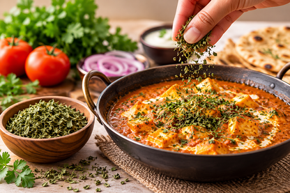 Paneer curry garnished with MDH Kasoori Methi dried fenugreek leaves, served with naan.