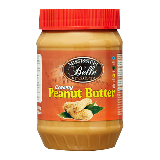 Jar of Mississippi Belle Creamy Peanut Butter with a smooth, creamy texture ready for spreading on toast.