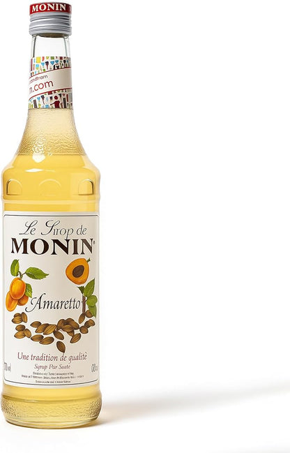 700ml bottle of Monin Amaretto Syrup, made with 100% natural flavors, ideal for vegan and allergen-free drinks.
