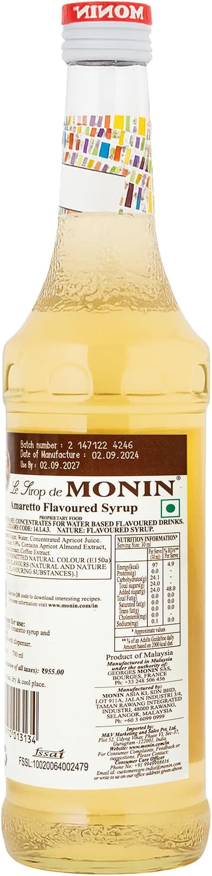 700ml bottle of Monin Amaretto Syrup, made with 100% natural flavors, ideal for vegan and allergen-free drinks.