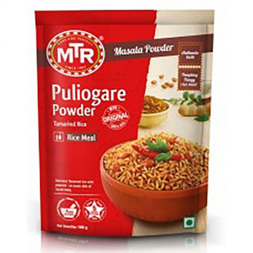 Front view of MTR Puliogare Powder (Tamarind Rice) 200g packet with red and brown packaging, featuring a bowl of seasoned tamarind rice garnished with herbs, labeled “Masala Powder” and “Rice Meal.”