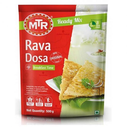Front view of MTR Rava Dosa Ready Mix 500g packet with red and green packaging, featuring crispy golden rava dosa pieces on a white plate, labeled “Ready Mix” and “Breakfast Time.”