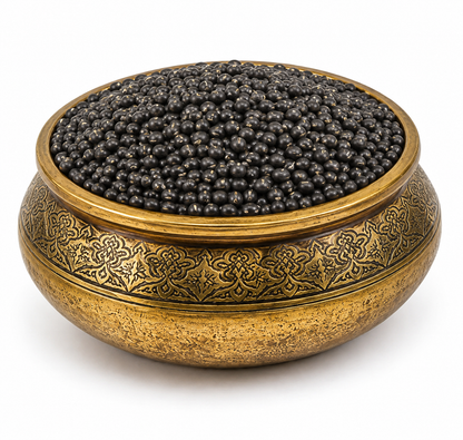 Premium Natco whole urid beans (black gram) displayed in a traditional decorative brass bowl on a white background.