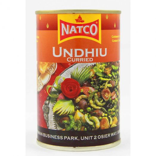 Can of Natco Undhiu Curried with orange label, featuring an image of mixed vegetables including beans and eggplant, branded “NATCO” at the top.