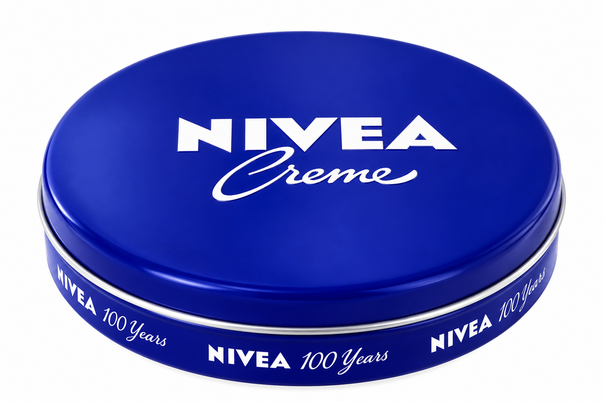 NIVEA Creme 60ml round blue cream tin featuring the iconic white NIVEA logo and Creme lettering on a glossy cobalt-blue lid, with a matching blue side band and silver rim, displayed against a clean white background.