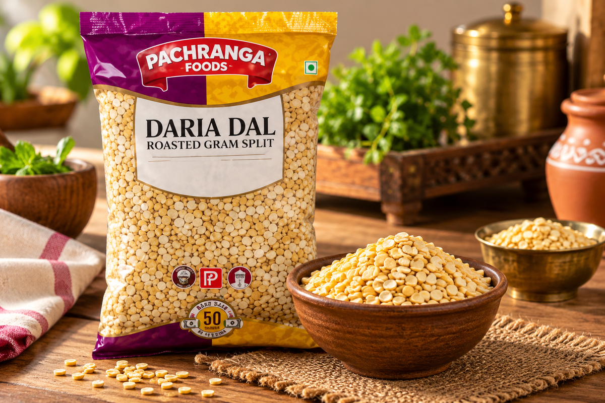 Pachranga Foods Daria Dal Roasted Gram Split 700g pouch displayed beside a bowl of roasted gram in a traditional Indian kitchen setting.
