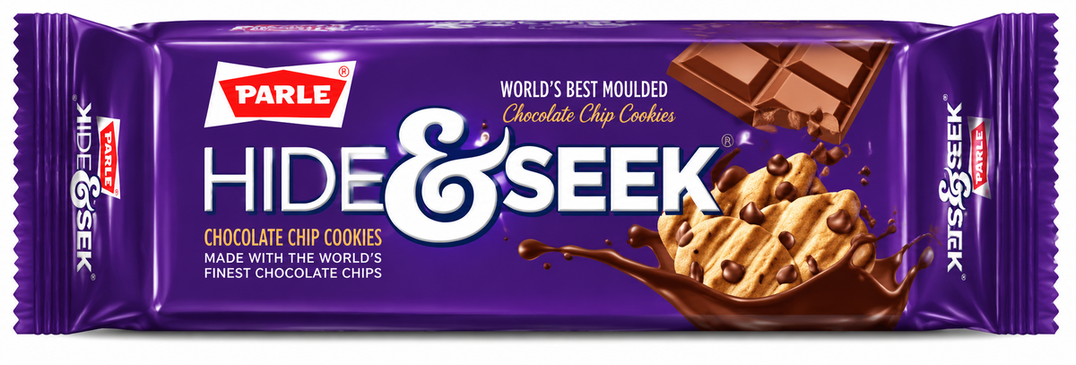 Parle Hide & Seek Chocolate Chip Cookies packet displayed behind a plate of chocolate chip biscuits, with chocolate pieces and a cup of tea on a wooden table.