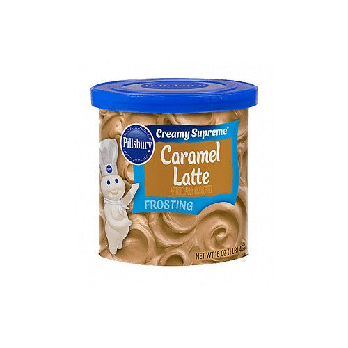 A jar of Pillsbury Caramel Latte Frosting, featuring a smooth, creamy texture with a blend of caramel and coffee flavors, perfect for decorating cakes, cupcakes, and other desserts.
