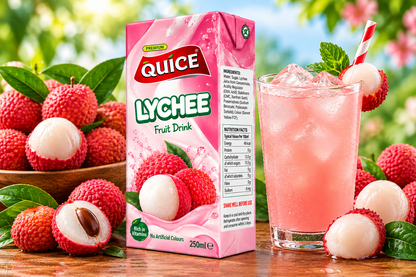 Quice Lychee Fruit Drink 250ml carton beside a glass of chilled pink lychee drink with ice, fresh lychees and green leaves.