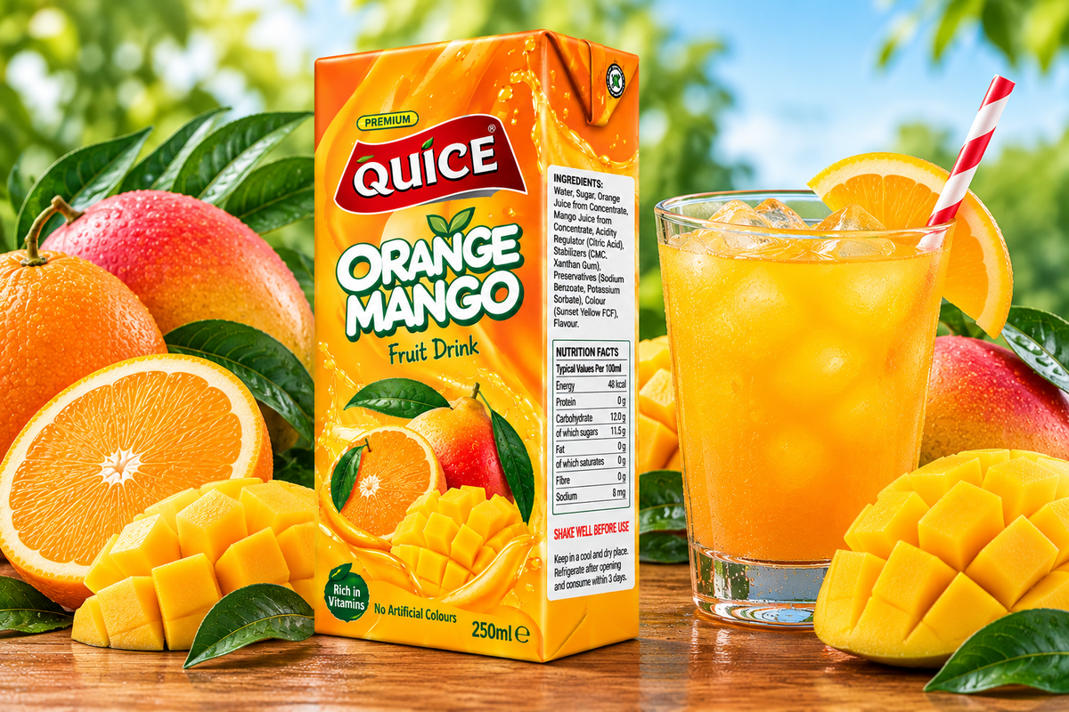 Quice Orange Mango Fruit Drink 250ml carton beside a glass of chilled orange mango beverage with ice, fresh orange slices, mango pieces and green leaves.